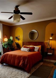 a bed room with a neatly made bed and a ceiling fan