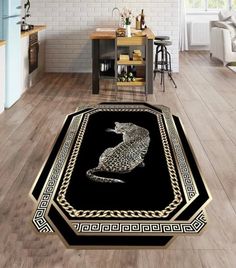 a black and gold area rug with an image of a cat sitting on top of it