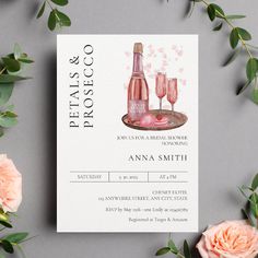 a wedding card with pink roses and champagne