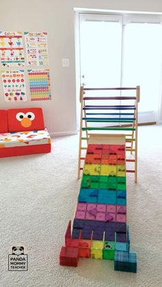 a child's play room with colorful blocks on the floor