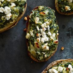 an appetizer is shown with baked potatoes and spinach toppings on them