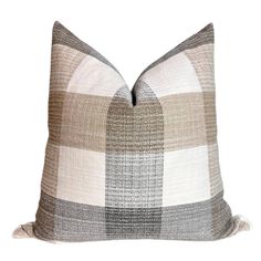 Add a touch of elegance to your space with this handmade decorative pillow cover, thoughtfully crafted in the USA. Designed with a timeless plaid pattern in neutral beige and gray tones, this cover is made from an indoor/outdoor-friendly material, making it perfect for both cozy interiors and stylish patios. Featuring a sleek invisible zipper, it ensures a polished and seamless look while offering easy removal for cleaning. Each pillow cover is made to order, guaranteeing exceptional quality and attention to detail. Whether styling your living room, bedroom, or outdoor seating area, this versatile pillow cover adds sophistication and warmth to any setting. Key Details: Material: Durable, indoor/outdoor-friendly woven fabric. Size: Custom sizes available--just send us a message! Insert: Not Farmhouse Throws, Linen Pillow Covers, Neutral Beige, Cozy Interior, Gray Plaid, Grey Tones, Key Details, Linen Pillows, Buffalo Check