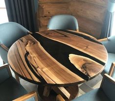 a wooden table with blue chairs around it