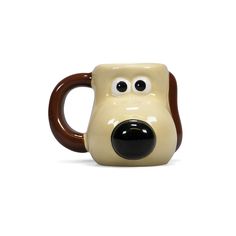 a ceramic mug with a dog's face on it