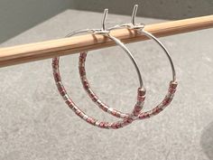 "Minimalist and dainty, these beaded hoop earrings go with everything! Alternating tiny Miyuki Delica seed beads in metallic shades of silver, pink (rose gold), and gold give these an elegant and classic look.  This pair of beaded hoops is made with genuine Japanese Miyuki Delica seamless glass cylinder seed beads.  The hoop size is 25 mm diameter (approximately 1 inch circle), and is made with hypoallergenic, nickel-free, and lead-free 22-gauge wire (0.7mm thick).  𝗦𝗘𝗖𝗢𝗡𝗗𝗔𝗥𝗬 𝗖𝗢𝗟𝗢𝗥 Silver Hoop Earrings With Tiny Beads As A Gift, Silver Hoop Earrings With Tiny Beads, Silver Small Hoop Earrings With Tiny Beads, Small Silver Hoop Earrings With Tiny Beads, Handmade Pink Minimalist Hoop Earrings, Minimalist Handmade Pink Hoop Earrings, Everyday Beaded Silver Hoop Earrings, Everyday Silver Beaded Hoop Earrings, Rose Gold And Gold