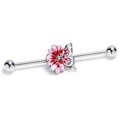 a pink flower on a silver barbell ring