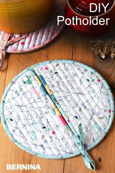 an image of a magazine cover with sewing supplies on the table and in the background