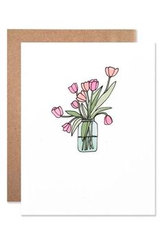 a card with pink tulips in a mason jar on top of a white background