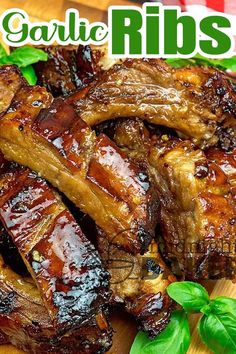 grilled ribs on a cutting board with basil leaves