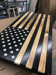 an american flag made out of wood sitting on top of a table