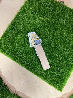 a piece of grass with a sticker on it