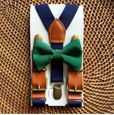 Dark Green Bow Tie & Navy Faux Leather Suspenders- The Perfect Wedding Look! Our navy blue bow tie & suspenders is a great choice for family photos, wedding, ring bearer outfit, birthday celebration or any other special occasion. ❤ **Please Specify Above** SET- Bow Tie and Suspenders SUSPENDERS- One Pair of our Quality Suspenders BOW TIE- One Bow Tie on white elastic strap or alligator clip Small: 9 months- 5 years *Bow Tie: 3.5in wide *Suspenders: Elastic, Y Back, 16in- 27in Medium: 6 y Bow Tie And Suspenders Set For Father's Day Party, Adjustable Ribbon Bow Gift, Adjustable Blue Bow With Ribbon, Adjustable Belts And Suspenders For Father's Day Gift, Adjustable Blue Ribbon Bow, Adjustable Belts And Suspenders As Father's Day Gift, Adjustable Green Bow Tie For Father's Day, Adjustable Ribbon Bow Tie As Gift, Wedding Ring Bearer Outfit