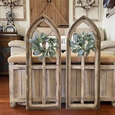 two wooden benches sitting next to each other on top of a hard wood floor covered in furniture