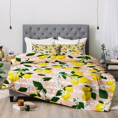 a bed with yellow lemons on it