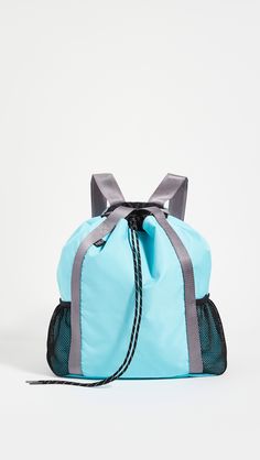 Fabric: Technical weave Water-resistant Drawstring top Mesh side pouches and front snap pocket Interior patch pocket Adjustable shoulder straps Lined Weight: 13oz / 0.37kg Imported, Taiwan Measurements Height: 15.25in / 39cm Length: 17in / 43cm Depth: 5.5in / 14cm Handle drop: 4.25in / 11cm Drawstring Top, One Bag, The Studio, Fashion Designer, Patch Pocket, Accessories Design, Taiwan, Designer Clothing