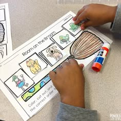 a boy is working on his book about animals