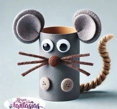 a close up of a paper cup with a mouse on it's face and eyes