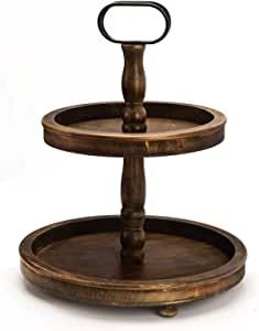 two tiered wooden tray with metal ring on each side and round bottom, set against a white background