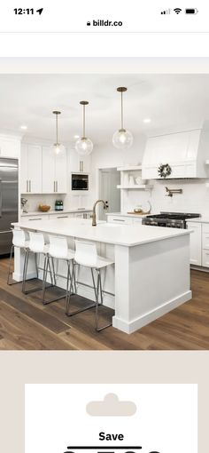 a white kitchen with an island and bar stools in front of the counter top