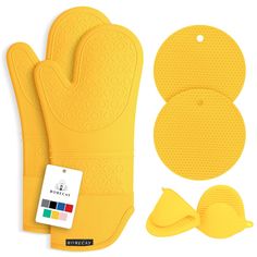 the yellow oven mitts and pot holders are next to each other, including one with a