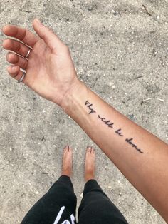 a person holding their arm up with the words may not be mine written on it