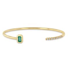 14k gold thicker round wire open cuff bracelet with a bezel set emerald cut green emerald on one end and french pavé set diamonds on the other end SPECIFICS • cuff wire is approx. 2mm wide• total bracelet is approx. 6.4cm wide x 5cm tall• cuff opening is approx. 28mm• emerald-cut emerald is approx. 5mm x 3mm• white diamonds .16 ctw Diamond Cuff Bracelet, Slide Bracelet, Emerald Bracelet, Open Cuff Bracelet, Gold Bracelet Cuff, Emerald Jewelry, Green Emerald, Bracelet Sizes, Emerald Cut