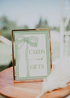 a card that says cards and gifts on it sitting on top of a wooden table