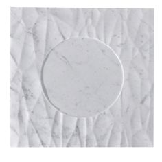 a white marble plate sitting on top of a piece of paper