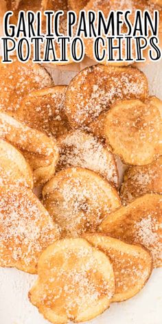 garlic and parmesan potato chips on a plate with powdered sugar over them