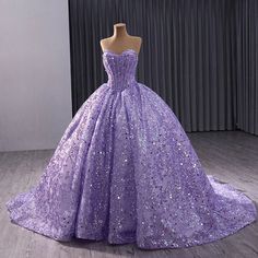 Stunning quinceañera dress in a vibrant purple hue, perfect for a 15th birthday celebration. Features a sweetheart neckline and a sleeveless design for a touch of elegance. Adorned with sparkling embellishments for added glamour and shine. Crafted with high-quality materials for a luxurious and comfortable feel. Flattering fit that enhances the feminine silhouette, creating a regal appearance. Ideal attire for young girls celebrating their quinceañera in style. Elevate the special occasion with Lavender Glitter Dress, Dresses For 15, Purple Ball Gown, Debut Gowns, Purple Quinceanera Dresses, 15 Girls, Quinceanera Themes Dresses, Quinceañera Dresses, Chic Evening Dress