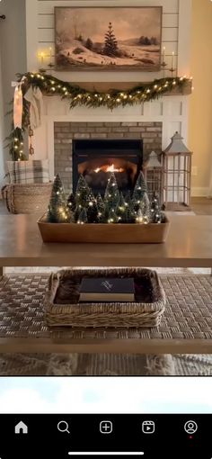 a living room with a fire place and christmas decorations