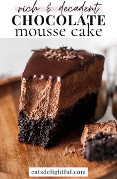 a piece of chocolate mousse cake on a wooden plate with the words rich and decadent chocolate mousse cake