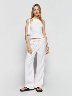 Wear the pants. Shop the Olina Linen Pant from Reformation, sustainable linen pants for spring and summer. White Linen Pants, Linen Pant, Italian Women, Cropped Denim Jacket, Baggy Pant, Linen Trousers, Linen Top, Linen Dresses, Linen Pants