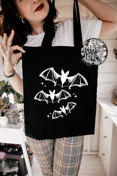 For more visit my Website at www.MySpookyLittleHeart.com Black Canvas Bag . No zipper. Design is made of plastisol ink. This bag is perfect to carry all your spooky and witchy things.  stay weird, weird bitches only, stay weird tote bag, black canvas tote, Witchy Tote Bag, Spooky Bag, Gothic gift, goth bag, witchy woman, bruja, witchy things, witchy gift for bestfriend, Halloween bag, gothic tote, gift for friend, valentines day gift, vday gift, goth beach bag, everyday bag, goth bag to carry th Alternative Halloween Bags For Daily Use, Alternative Style Halloween Bags For Daily Use, Black Grunge Bag For Halloween, Gothic Halloween Bags For Alternative Fashion, Handmade Black Bag For Halloween, Goth Beach, Gothic Bags, Goth Tote Bag, Goth Bag