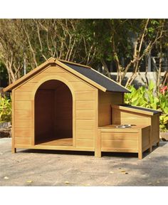 a wooden dog house with its door open