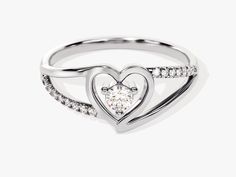 Make a statement with this classic Split Shank Diamond Heart Ring. Crafted with 0.18 ct of diamonds and set in 14K solid gold, this piece of jewelry makes a beautiful and romantic gift. Enjoy the timeless design and dazzle your loved one with its elegant sparkle. DETAILS: --Size Range: 2 US - 11 US--Weight (in 14k Gold): ~ 1.74 grams for Size 6.5 (Depends on the size)--Gold Kt Options: 14k and 18k--Color Options: Yellow Gold, Rose Gold and White Gold--Gemstone: Diamond--Diamond Cut: Round--Numbe Diamond White Solitaire Heart Ring For Anniversary, Diamond Heart Solitaire Rings, Dazzling Diamond White Heart Ring For Promise, Diamond White Promise Heart Ring, Heart Shaped Diamond Solitaire Rings, Heart-shaped Diamond Solitaire Rings, Elegant Brilliant Cut Diamond Ring For Valentine's Day, Elegant Round Cut Diamond Ring For Valentine's Day, Elegant Round Diamond Ring For Valentine's Day