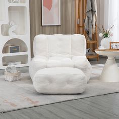 a white recliner chair sitting on top of a rug