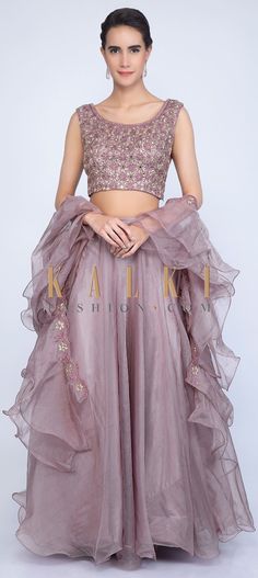 Buy Online from the link below. We ship worldwide (Free Shipping over US$100) Click Anywhere to Tag Rich mauve organza lehenga with embroidered blouse and ruffled dupatta only on Kalki Rich mauve organza lehenga with satin under layerIt comes with a matching organza blouse with self resham, mirror and cut dana floral jaal embroideryTeamed up with a matching ruffed organza dupatta with resham and cut dana embroidered border Mauve Lehenga, Mauve Saree, Bridesmaid Lehengas, Top Lehenga, Ruffle Dupatta, Crop Top Lehenga, Organza Lehenga, Kalki Fashion, Designer Lehengas