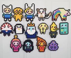 an assortment of pixel art magnets on a door