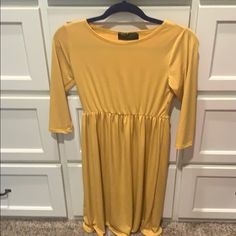 Polyester Spandex Like Material. Hits Right Above The Knee. Size Is Listed As Large I Think It Fits A Little Bit Smaller Spring Stretch Plain Dresses, Yellow Stretch Midi Dress For Fall, Spring Gold Stretch Mini Dress, Mustard Yellow Dress, Mustard Yellow Dresses, Yellow Dress, Above The Knee, Mustard Yellow, Polyester Spandex