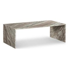 a white marble coffee table sitting on top of a floor