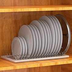 a bunch of plates that are sitting on a shelf