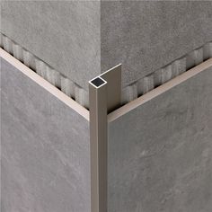 the corner of a wall with an aluminum frame