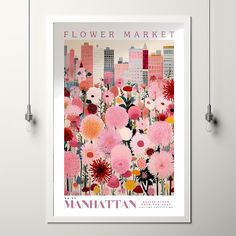 a flower market poster with pink flowers in the foreground and city buildings in the background