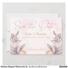 save the date card with watercolor flowers on pink and gold foil, in front of a marble background