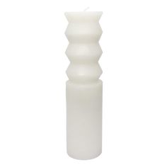 a tall white candle holder on a white background with a single lit candle in the middle