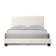 a white bed with grey sheets and pillows on it's headboard, in front of a white background