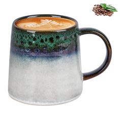 a ceramic coffee mug with an image of a tree in the middle and pineconi sprouts above it