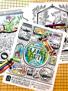 two coloring pages with crayons on top of them next to markers and pencils