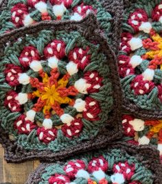 four crocheted coasters with flowers on them